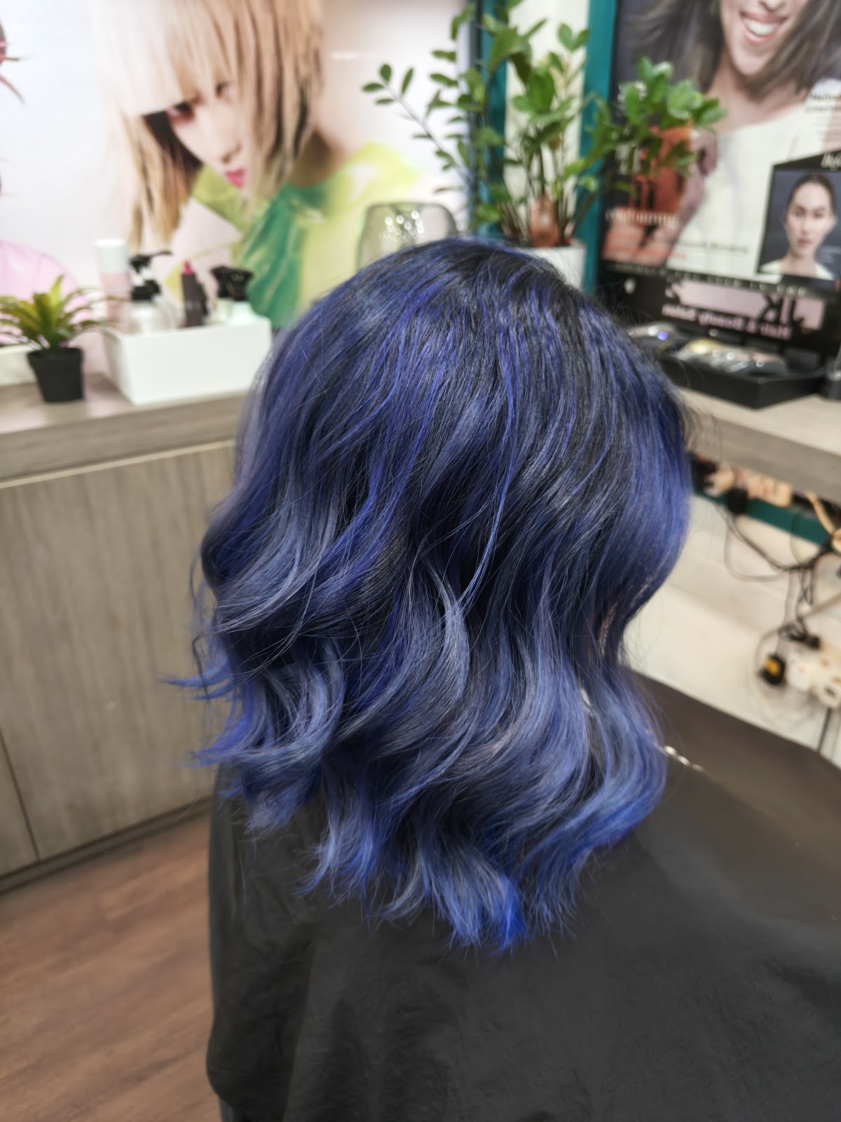 Blue and silver balayage on a wavy bob, photographed from behind